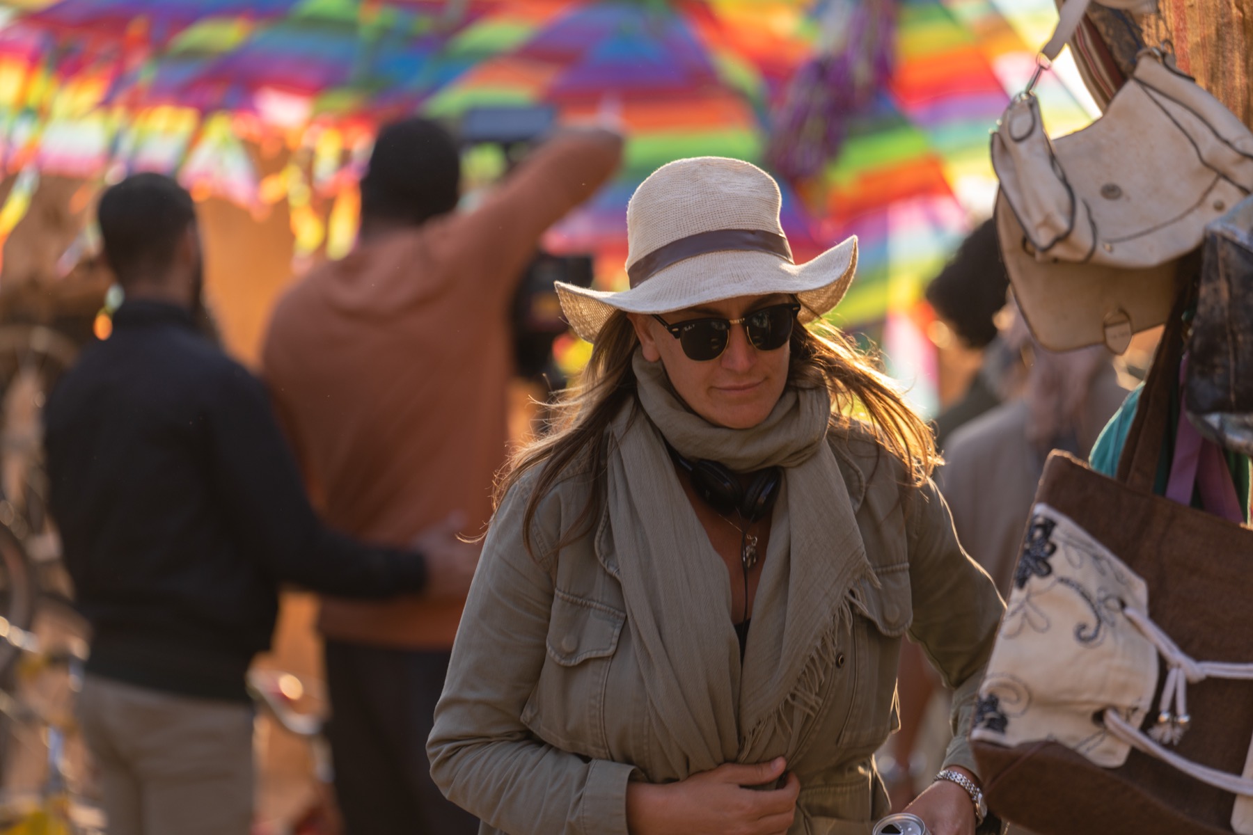 Ashley Avis directing on the colorful market set of The Lamb