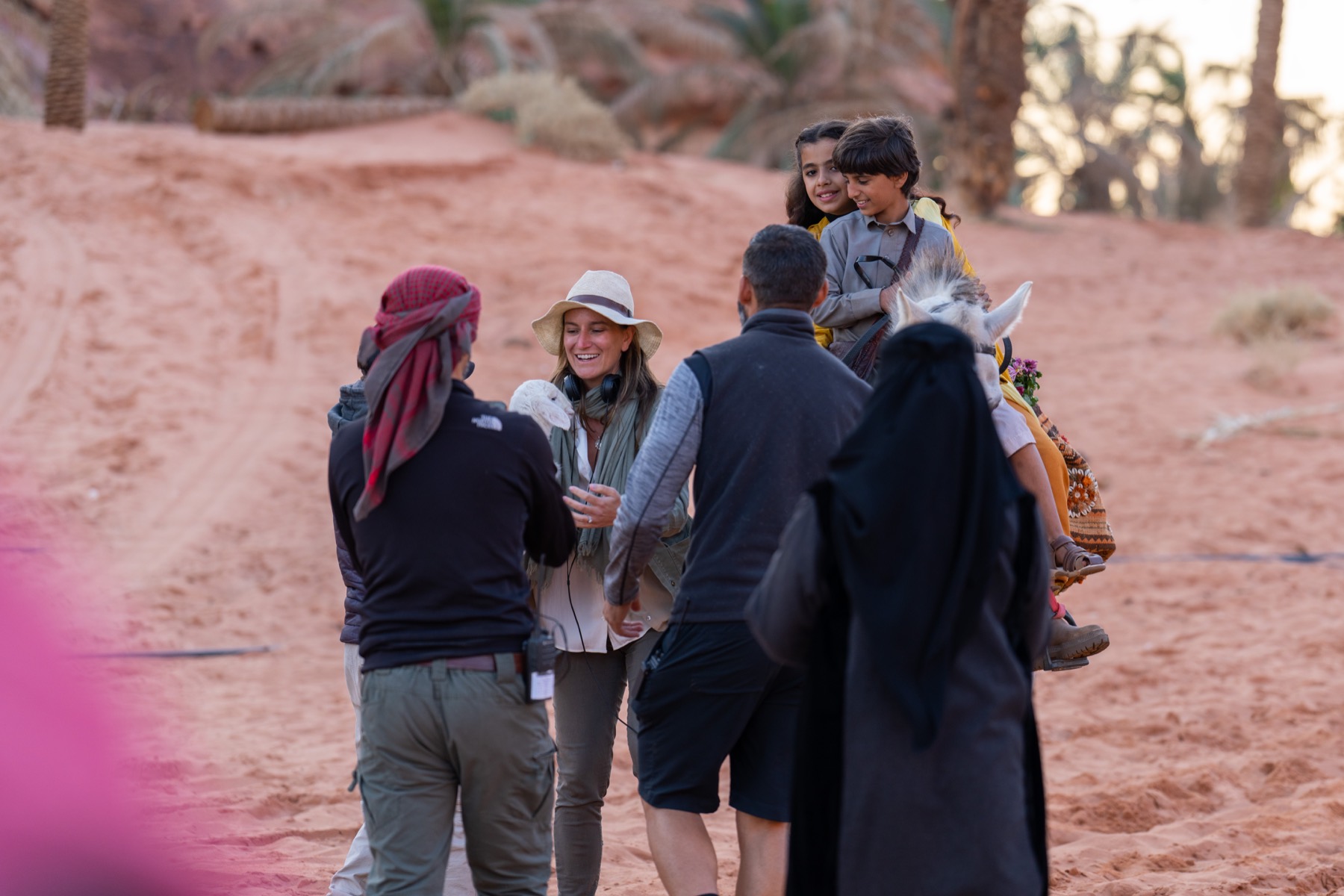 Ashley Avis, Abdulaziz Alqahtani, the lamb, and crew on location
